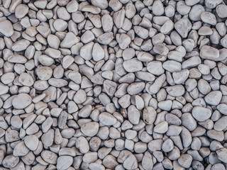 Decorative stones , round stones on white background , Stones or Gravel for building, floor or wall. Seamless Texture. Pebbles.