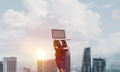 Business woman with laptop instead of head.