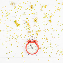 New Year composition alarm clock golden confetti