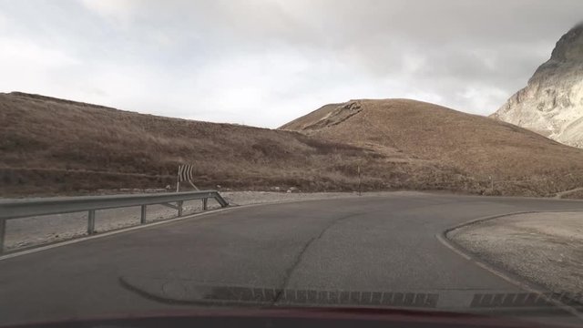 POV driving through Passo Pordoi in the Dolomites, Italy.