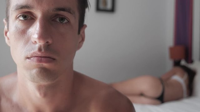 Young couple having problems in bed