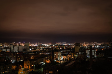 Fototapeta na wymiar city with illuminated buildings and streets at night