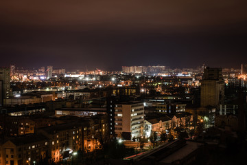 cityscape with illuminated buildings and streets at night