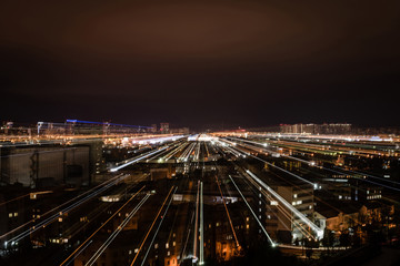 Fototapeta na wymiar night cityscape with blurred bright illumination