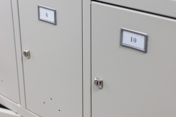 Concept of security. Metal locker storage of personal belongings in a public place or warehouse. close-up. selective focus. copy space for decor or design