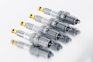 Spare parts spark plugs on white background for car and motorcycle. New auto parts spark plug. 3D rendering