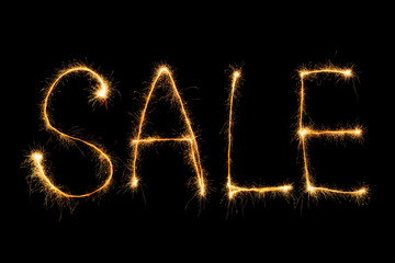 close up view of sale light sign on black backdrop