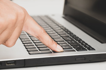 lady Hands typing on laptop keyboard