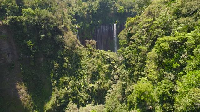 aerial view waterfall coban sewu in Java, indonesia. waterfall in tropical forest by drone Tumpak Sewu aerial footage