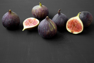 Fresh figs on black background, side view. Closeup.