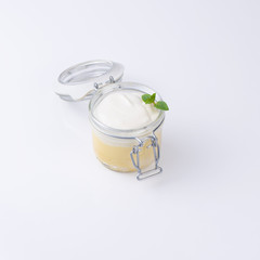 Sweet dessert in a special bottle isolated on white background.