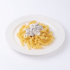 Pasta with bechamel sauce isolated on white background.