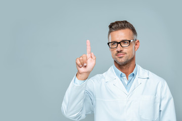 handsome scientist in white coat and glasses touching something in air isolated on white,...