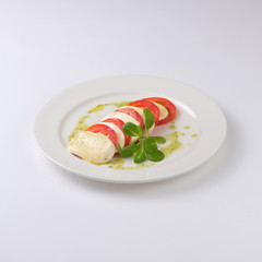 Fried tomatoes with parmesan isolated on white background