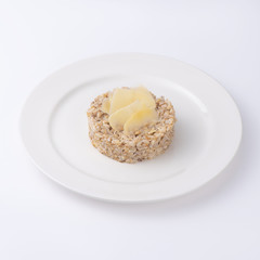Cooked buckwheat porridge on plate. Isolated on a white background,