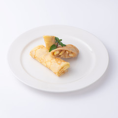 Two Pancakes with apple isolated on white background