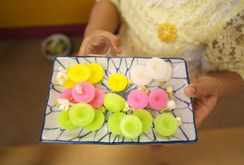 Bangkok,Bangkok,Thailand-December 8, 2018: Khanom Nam Dok Mai, flower scented Thai sweets or floral rice cakes

