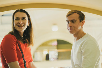 young happy smiling male and female talk each other indoors  f