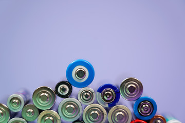 Many different types used or new battery, rechargeable accumulator, alkaline batteries on color...