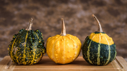 Pumpkins on a wooden cutting board