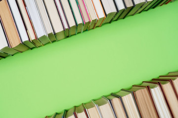 Many Books Piles. Hardback books on wooden table. Back to school.