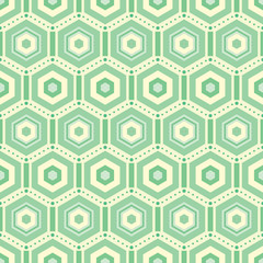 Vector geometrical seamless pattern of hexagons decorated with dotted zigzag lines and small rectangles in green and yellow colors. Perfect for wallpaper, scrapbooking, packaging, fabric.