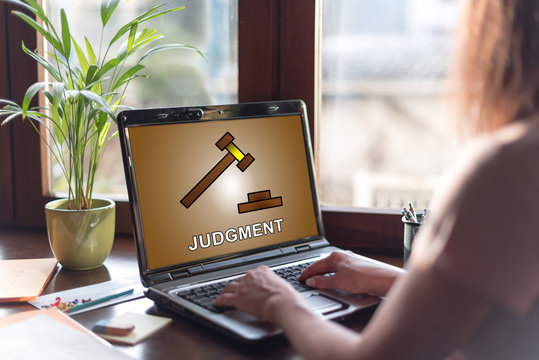 Judgment concept on a laptop screen