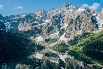 Reflection of mountains in water of Morskie Oko Lake, Tatra Mountains, Poland © v_supertramp