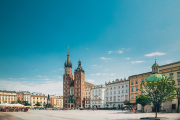 Fototapeta na wymiar Krakow, Poland. St. Mary's Basilica And Cloth Hall Building. Fam