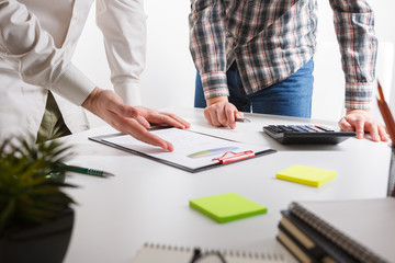 Business concept. Two business mans working and meeting with chart at office on his desk.