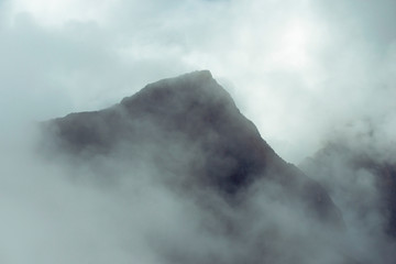 mountain peak in fog
