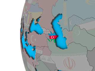 Azerbaijan with national flag on blue political 3D globe.