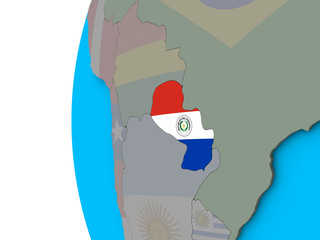 Paraguay with national flag on blue political 3D globe.