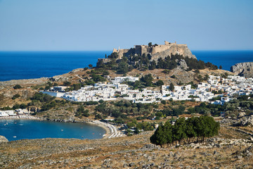 Medieval fortress and white houses of Lindos village in Rhodes..