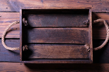 Empty wooden box on wooden background