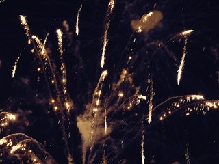 abstract, fireworks, blurred image. Christmas background. Light with glowing sparks, merry christmas