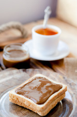 Toast with peanut butter and a cup of tea.