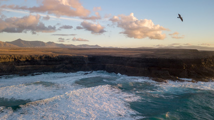 aerial view west coast of Fuerteventura at sunset.