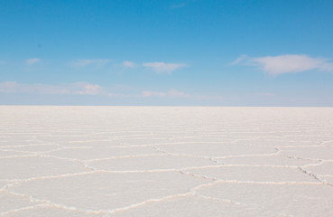 Uyuni Salar in Bolivia.  Blue Sky and white salt ground.