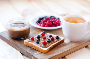 Toast with peanut butter and berries.