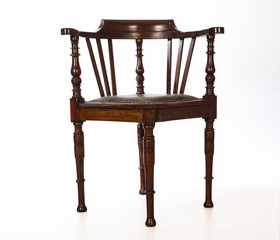 Wooden, old-fashioned corner chair. Isolated.