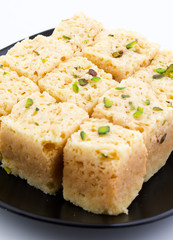 Indian Traditional Famous Sweet Food Mysore Pak or Mysoor Pak Isolated on White Background