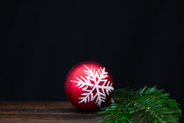  red christmas ball on black background