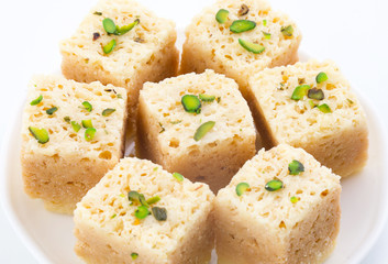 Indian Traditional Famous Sweet Food Mysore Pak or Mysoor Pak Isolated on White Background