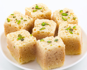 Indian Traditional Famous Sweet Food Mysore Pak or Mysoor Pak Isolated on White Background