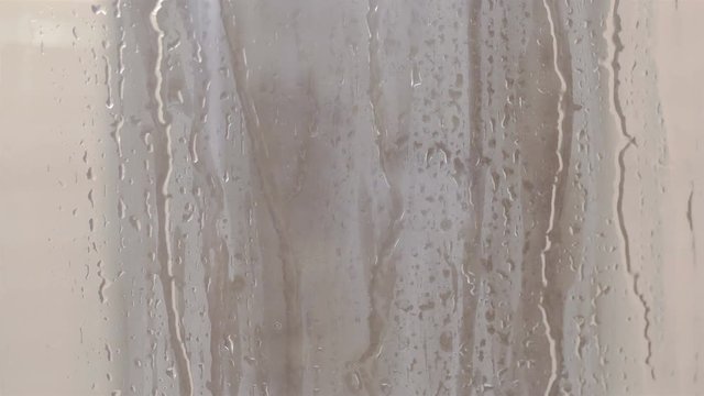 Water drops on window glass in 4k slow motion 60fps