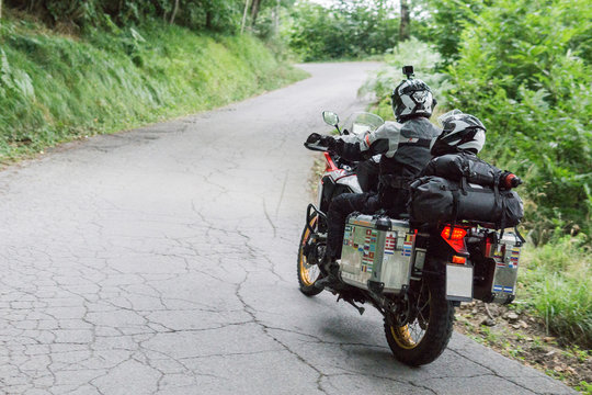 Father and son on a motorbike trip on a country road
