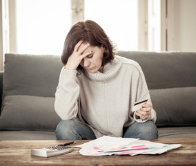 Upset young woman stressed about credit card debts and payments not happy accounting finances