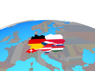 Central Europe with national flags on political globe.