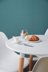 Breakfast with croissant and dessert on the white table